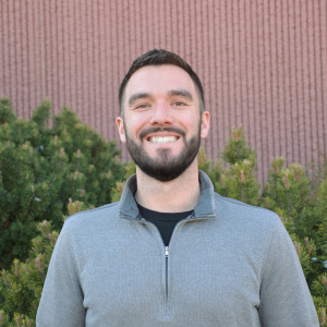 Chris Pawluczyk poses for a headshot at Applewood Seed Co.